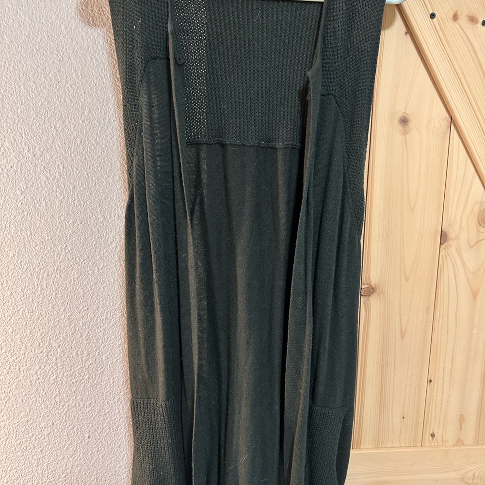Green knit sleeveless sweater